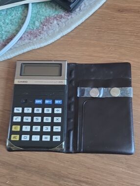 Casio LC-315 Portable Calculator in Black and Gold with Brown Case